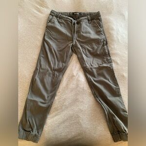 Green DUER cuffed cargo pants.